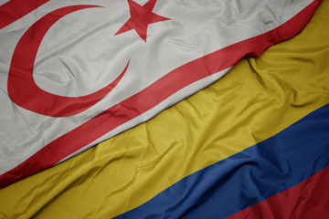 waving colorful flag of colombia and national flag of northern cyprus.