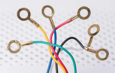 Thin telecommunication cables terminated with ring lug connectors