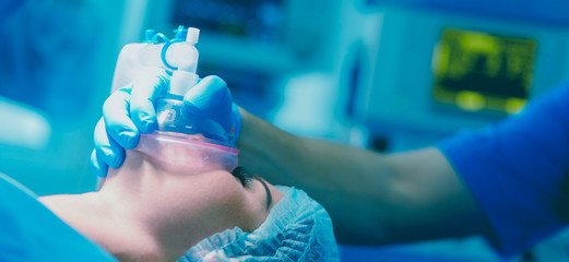 Man surgeon at work in operating room