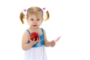 Little girl with apple. Isolated on white background.