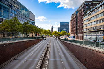 Road among Hamburg, Germany. Summer time. Cloudy day. City life.