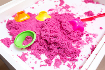 Kinetic Sand In A Heap For Indoor Game Or Children Creativity. Forms for the construction of the...