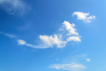 Naklejka na ściany i meble White scenic translucent cirrus cloud high in the blue summer sky. Different cloud types and atmospheric phenomena.