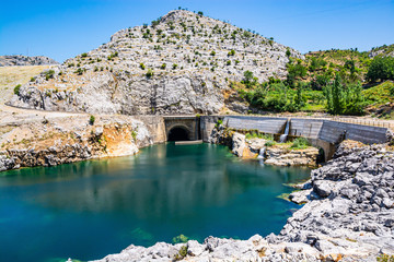 Fototapeta premium Water dam near Mjeda with clear water in river Drini, Albania