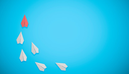 red paper airplane doing leadership on white paper airplanes, on blue background