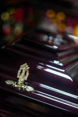 closeup shot of a colorful casket in a hearse or chapel before funeral or burial at cemetery