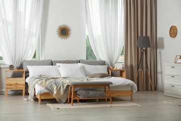 Stylish modern room interior with comfortable bed
