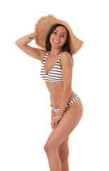 Pretty sexy woman with slim body in stylish striped bikini on white background