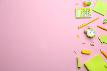 Bright school stationery on pink background, flat lay. Space for text