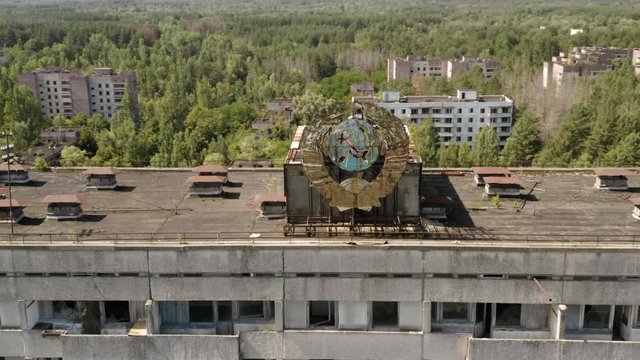 Soviet hammer and sickle sign on abandoned building in Pripyat near Chernobyl