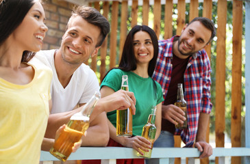 Young people enjoying picnic on summer day