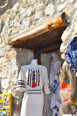 Traditional Romanian clothing with exquisite embroideries made with blue or gold silk threads on...