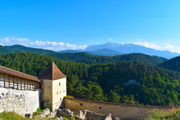 Panoramic landscape featuring historic Romanian fortress and its stone walls in the mountains of Transylvania. Boiana Brasov, Romania, the Balkans, Eastern Europe