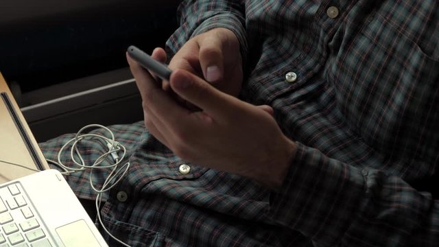 Man hands using mobile phone.