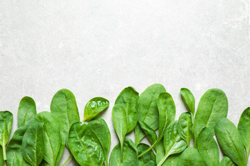 Fresh green healthy spinach on light table, flat lay. Space for text