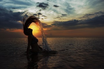 silhouette of woman at sunset
