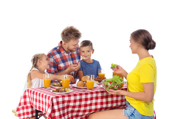 Happy family having picnic at table on white background
