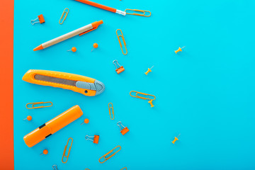 School and office supplies frame, on blue background with copy space, back to school.