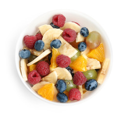 Fresh tasty fruit salad on white background, top view