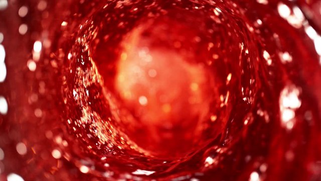 Super slow motion of pouring red wine in twister shape. Filmed on high speed cinema camera, 1000 fps.