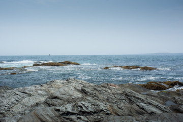 Coastline with rocks in foreground