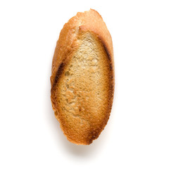 Toasted baguette slice isolated on white background close up.  Toast, crouton.   Top view.