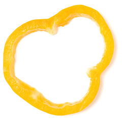 Yellow pepper slice isolated on white background cutout. Top view, flat lay.