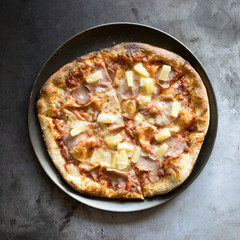 Hawaiian Pizza on a Concrete Background