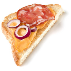 Canape with salami. Open faced sandwich crostini isolated on white background closeup. Appetizer tartarine.