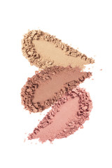 Face powder, bronzer, blush swatch isolated on white background. Nude eye shadow smear. Beige, brown, pink cosmetic powder texture.  Skin tone makeup foundation sample