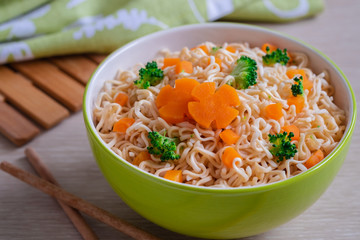 Instant noodle with vegetables in bowl