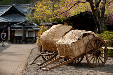 Wooden wagons and old houses create an atmosphere like the Edo Period, Edo Wonderland, Tochigi, Japan.