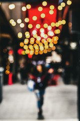 Patterns of illuminated globes under the marquee as is often used at the entrance to theatres and casinos and shopping centres