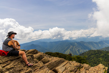 Hiker looking over Great Smoky Mountains National Park mountain range