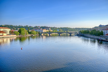Fototapeta na wymiar Early morning view of the along the Vltava River in the city of Prague, Czech Republic.
