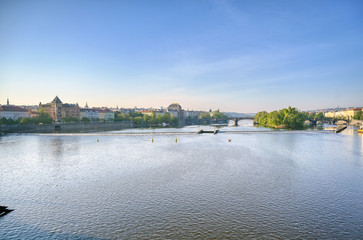 Fototapeta premium Early morning view of the along the Vltava River in the city of Prague, Czech Republic.