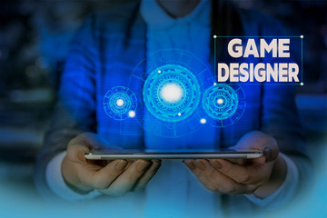 Handwriting text writing Game Designer. Conceptual photo Campaigner Pixel Scripting Programmers Consoles 3D Graphics Woman wear formal work suit presenting presentation using smart device