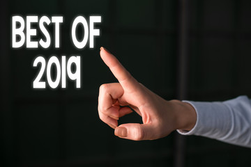 Writing note showing Best Of 2019. Business concept for great and marvelous things and events happened on 2019 Finger pointing in the Dark with hand pointing in the copy space