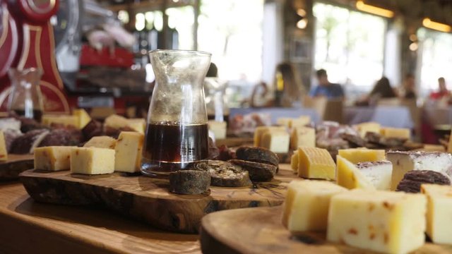Cheese,salami and wine on wooden table.Mediterranean food and traditions