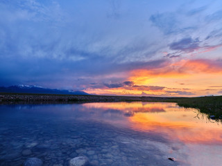 Obraz premium sunset time of human grassland in xinjiang