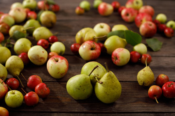Background from ripe juicy pears and apples for your design. Close-up. Harvest.