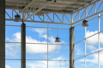 led high bay lights installed in warehouses Behind the scenes sky and clouds, Truss structure...
