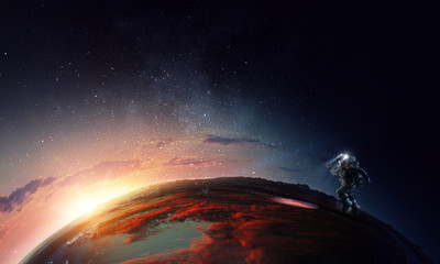 Spaceman and planet, human in space concept