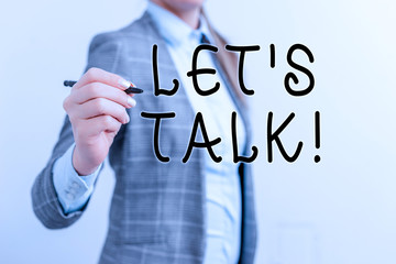 Writing note showing Let S Is Talk. Business concept for suggesting in the beginning of a conversation on the topic Business woman pointing in empty space with pen