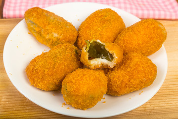 Bite Taken from One Of Plate of Jalapena Popper Appetizers