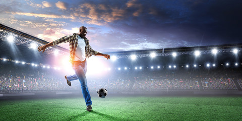 Naklejka na ściany i meble Soccer man in action with ball. Mixed media