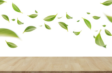Flying whirl green leaves in the air with wooden table, Healthy products by organic natural ingredients concept, Empty space in studio shot isolated on white background long banner