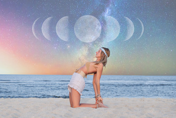 Beautiful woman is practicing yoga on the beach on Milky Way background.