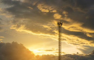 Telecom pole with dramatic sky at sunset