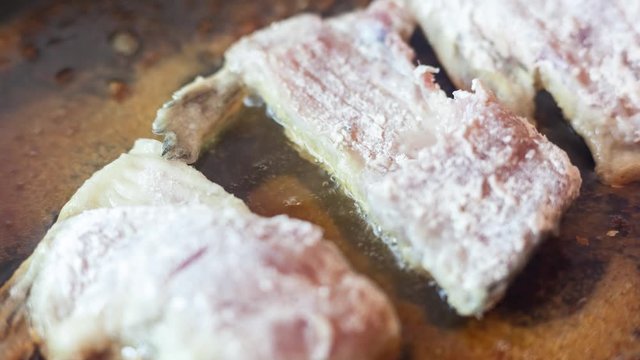 Fried fish in a pan. Fish fillet crucian, fried in a pan with sunflower oil for eating. Delicious food.